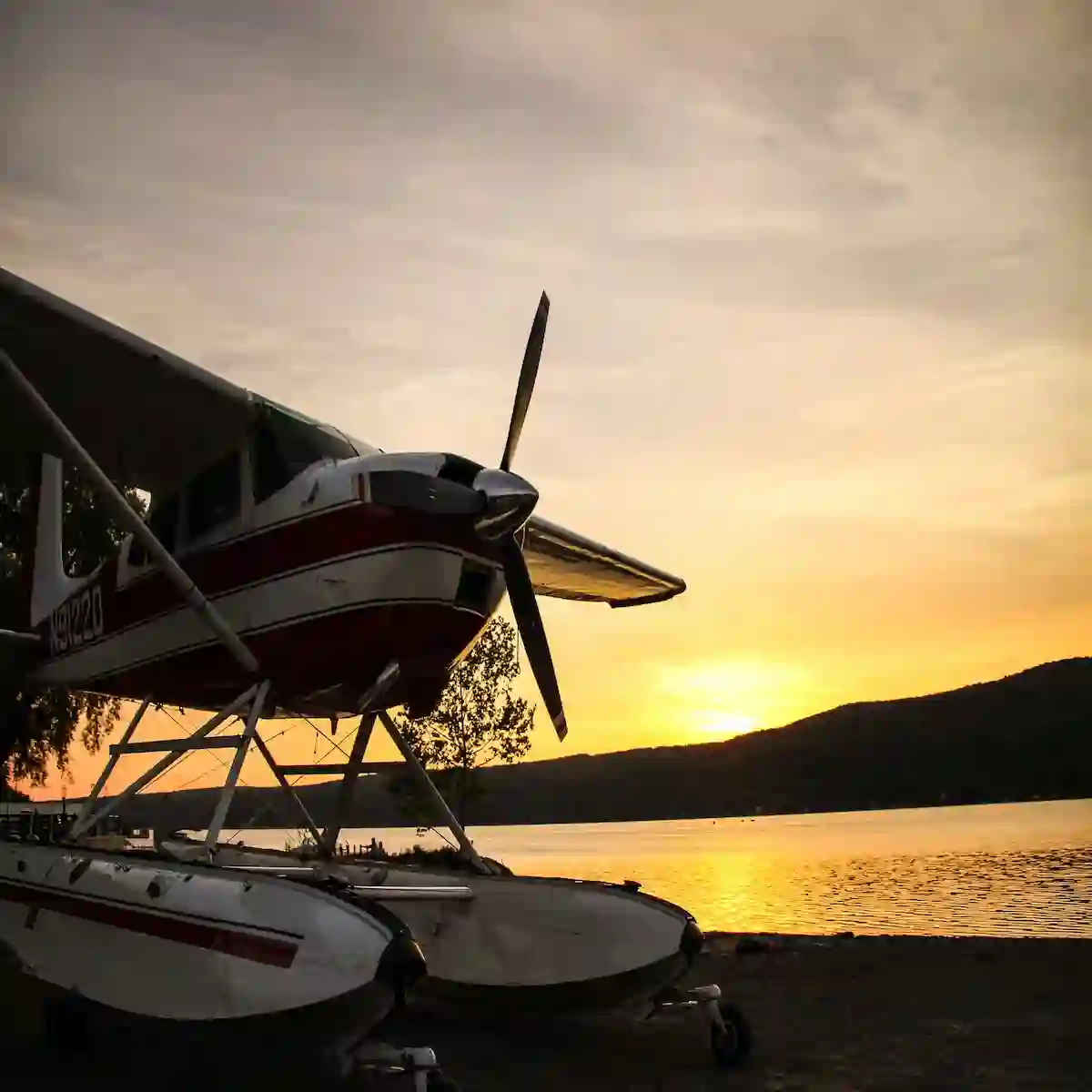 Shot of a seaplane next to the lake at sunset